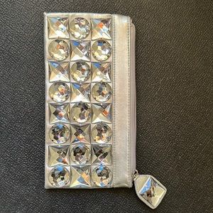 Steve Madden’s 💯 PVC Big Gemstone Silver Clutch in great shape. Used only once.